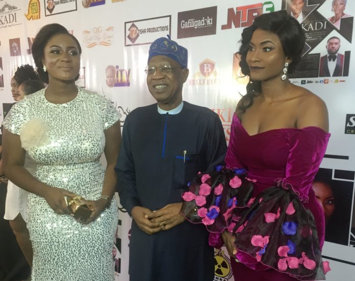 The Minister of Information and Culture, Alhaji Lai Mohammed, flanked by Aisha Mohammed, a movie producer and actress, and Josephine Ramos