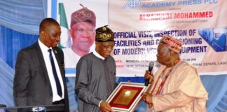 Hon. Minister of Information & Culture, Alhaji Lai Mohammed; Chairman, Academy Press Plc, High Chief Simeon Oguntimehin during the Minister's visit to Academy Press Plc in Lagos