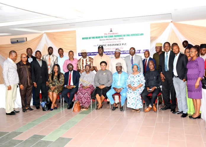 Permanent Secretary, Service Welfare Office, Mrs Didi Walson-Jack(seated M) and other participants at the event.