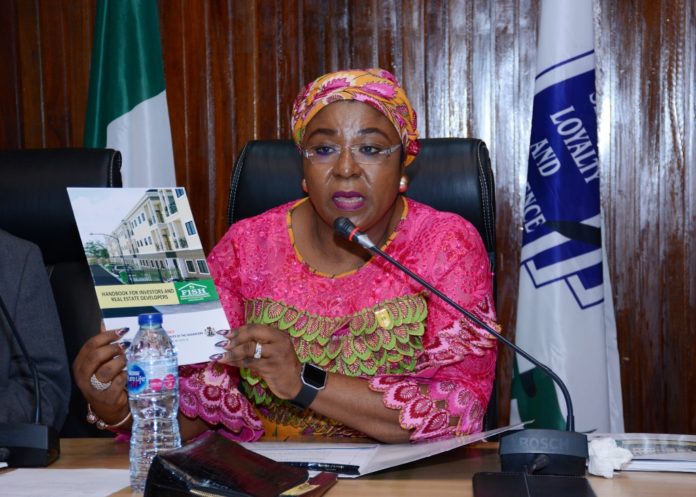 Permanent Secretary, Service Welfare Office, Mrs. Didi Walson-Jack displaying one of the FISH Handbooks during the meeting with FISH Developers in Abuja Permanent Secretary, Service Welfare Office, Mrs. Didi Walson-Jack displaying one of the FISH Handbooks during the meeting with FISH Developers in Abuja.JPG