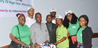 Officials with trainees.