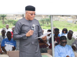 The Representative of the Permanent Secretary, EFO, Mr. Clinton Igwe presenting the Permanent Secretary's speech at the Pre-Project Sensitization programme organized for the residents of Trademore/VoN Estates, Sabon Lugbe, FCT Abuja on the 27th July, 2019