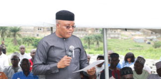 The Representative of the Permanent Secretary, EFO, Mr. Clinton Igwe presenting the Permanent Secretary's speech at the Pre-Project Sensitization programme organized for the residents of Trademore/VoN Estates, Sabon Lugbe, FCT Abuja on the 27th July, 2019