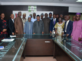 The Honourable Minister of Health, Dr. Osagie Ehanire (5th from left); the Permanent Secretary, Mr. Abdulaziz Mashi Abdullahi (4th from left) in a group with JOHESU members during a courtesy call in Abuja.