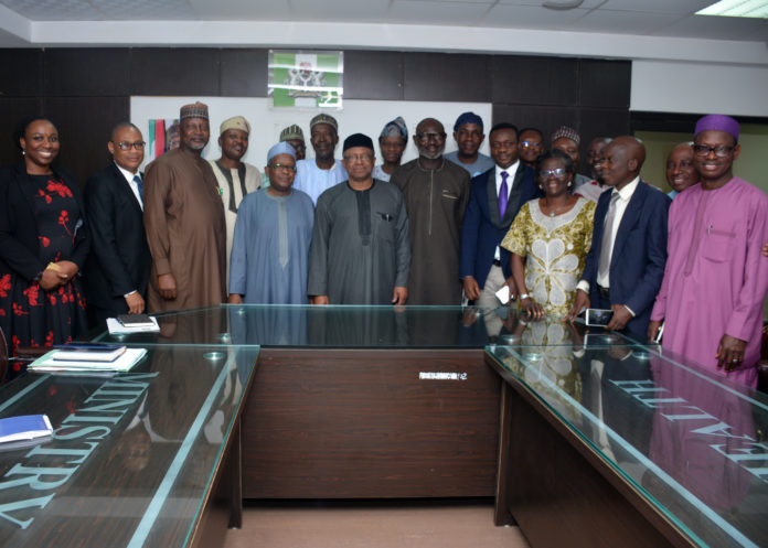 The Honourable Minister of Health, Dr. Osagie Ehanire (5th from left); the Permanent Secretary, Mr. Abdulaziz Mashi Abdullahi (4th from left) in a group with JOHESU members during a courtesy call in Abuja.