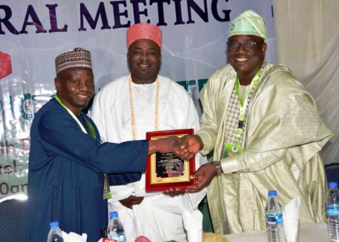 L-R: Engr. Habu Gumel, President Nigeria Olympic Committee ( NOC) presenting an award to the Hon. Minister, Mr Sunday Dare; ably represented by Mr Adesola Olusade, Permanent Secretary of the Ministry; at the Annual General Meeting of the Nigeria Olympic Committee (NOC) held in Gwarimpa, Abuja. The Plaque award was in recognition of the Hon. Minister's zeal and commitment to the timely completion of the Headquarter/Secretariat Building of the Association of National Olympic Committees of Africa ( ANOCA) in the F.C.T, Abuja.