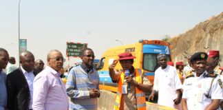 FCT Minister, Malam Muhammad Musa Bello, (4th left) listening to explanations from an FRSC official at the Gwarimpa U-Turn on the Outer Northern Expressway. with him is the Executive Secretary, FCDA engr Umar Gambo Jibrin (3rd left) and Task Team Chairman, Ikharo Attah (2nd left)