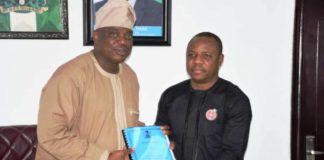 Occasion of the Handing Over-Ceremony at the Federal Ministry of Youth and Sports Development: Left is the Out-Going Permanent Secretary, Mr Olusade Adesola exchanging and releasing the Hand- Over Report to In- Coming Permanent Secretary, Mr Gabriel Tanimu Aduda, held today, Monday 23rd December, 2019.