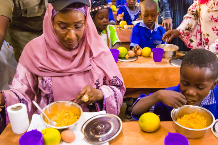 The Honourable Minister of Humanitarian Affairs, Disaster Management and Social Development, Sadiya Umar Farouq during a Home Grown School Feeding Programme.