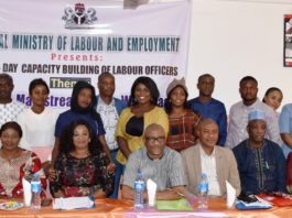 The representative of Permanent Secretary, Federal Ministry of Labour and Employment, Mr. Emmanuel Igbinosu (centre) flanked on the left by former Director Inspectorate Department of the Ministry Mrs. Amahian Jegbefumen and on the right by the Ag. Director, Inspectorate, Mr. Ajuwon Dauda and other participants of a Capacity Building workshop on Gender Mainstreaming in Workplace