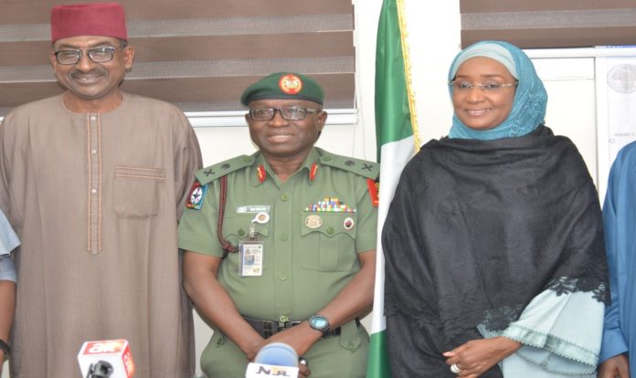SAFE CORRIDOR RIGHT, THE HONORABLE MINISTER OF HUMANITARIAN AFFAIRS, DISASTER MANAGEMENT AND SOCIAL DEVELOPMENT, HAJIYA SADIYA UMAR FAROUQ, MIDDLE, COORDINATOR OF OPERATION SAFE CORRIDOR, MAJ. GEN. BAMIDELE SHAFA (REPRESENTING THE CHIEF OF DEFFENCE STAFF) LEFT, THE PERMANENT SECRETARY OF THE MINISTRY, TIJJANI UMAR.
