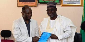 (Right) The Honourable Minister of Water Resources, Engr. Suleiman H. Adamu FNSE, FAEng presenting Water Use License to the Chief Executive Officer of North South Gurara Power Company, Dr. Olubunmi Peters yesterday in Abuja