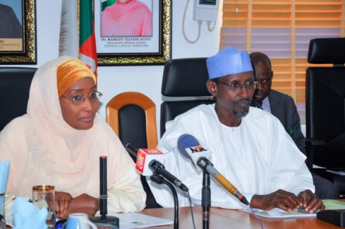 From Left the Hounourable Minister of Humanitarian Affairs, Disaster Management and Social Development, Hajiya Sadiya Umar Farouq and the Minister of the Federal Capital Territory (FCT) Alhaji Mohammad Musa Bello (right) during a courtesy call on the Honourable Minister in his office