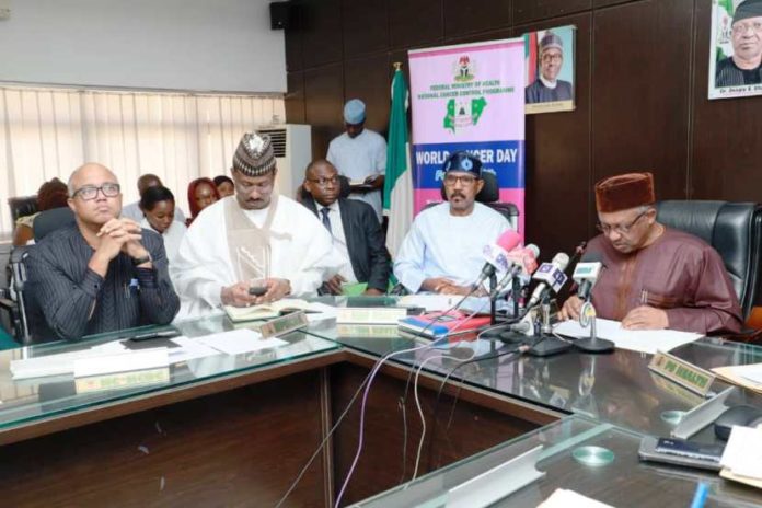 The Minister of Health, Dr. Osagie Ehanire(R) addressing the press at the 2020 World Cancer Day Commemoration