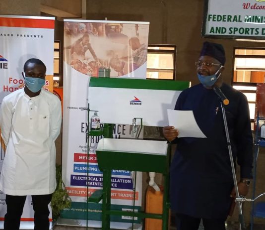 HM Suday Dare and the inventor of the Hand Sanitizer Machine Mr Jerry Mallo from Jos, Plateau state.
