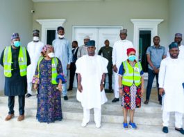 2nd Left; The representative of the Honourable Minister of Humanitarian Affairs, Disaster Management and Social Development (Head of Special Duties, of the Ministry, Nadia Muhammed-Soso) 3rd left; the Executive Governor of Kogi State, His Excellency, Yahaya Bello