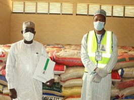 Left; The Representative of the Honourable Minister of Humanitarian Affairs, Disaster Management and Social Development Hajia Sadiya Umar Farouq, (Deputy Director, Disaster Management of the Ministry, Dr. Abubakar Suleiman), handing over food items as part of the COVID-19 pandemic palliatives to the Representative of the Katsina State Governor, His Excellency, Alhaji Aminu Bello Masari (The Special Adviser and Focal Person on Humanitarian Affairs, Alhaji Abubakar Nasir)