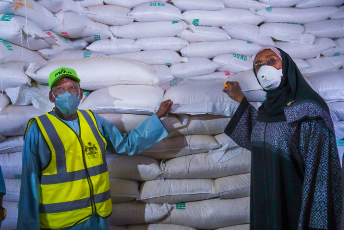DSC05127 (Right) The Honourable Minister of Humanitarian Affairs, Disaster Management and Social Development, Sadiya Umar Farouq and the His Excellency, Executive Governor of Kano State, Dr. Abdullahi Umar Ganduje during the inspection of food palliatives handed over to Kano State Government at the KASCO warehouse on Sunday 17, 2020
