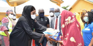 (Left) Honourable Minister of Humanitarian Affairs Disaster Management and Social Development, Sadiya Umar Farouq, presenting palliative to a beneficiary, during the flag-off for the distribution of relief materials to the Older Persons at Karshi, Abuja, over the weekend.