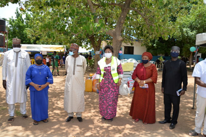 DSC_2732 (3rd left) Representative of the Honourable Minister of Humanitarian Affairs, Disaster Management and Social Development, the Special Adviser on Humanitarian Affairs, Alhaji Musa Bungudu; (4th left) Director Disaster Management of the ministry, Dr Dorathy Nwodo, (5th left) Head of Special Duties of the ministry, Nadia Soso-Muhammed, President of the Coalition of Orphanages and Children Homes in Abuja, Senator Eze Ajoku, (1st left) Representative of the Chairman Gwagwalada Area Council Honourable Mohammed Kassim and (2nd left), General Coordinator ANAWIM Home (poorest of the poor) Reverend Sister Oresoa-Selo Ojeme, during the flag off of distribution of palliatives to orphanage homes in FCT