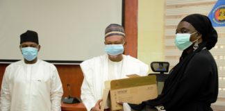 (Middle) The Permanent Secretary of the Ministry of Humanitarian Affairs, Disaster Management and Social Development, Jalal Arabi receiving an ICT equipment from the ECOWAS Commissioner for Social Affairs and Gender, Siga Fatima Jagne; (Left) The Director-General of National Emergency Management Agency (NEMA) AVM Muhammadu Muhammed Rtd. during the presentation of Information and Communication Technology (ICT) equipment on behalf of the ECOWAS Commission to the Ministry
