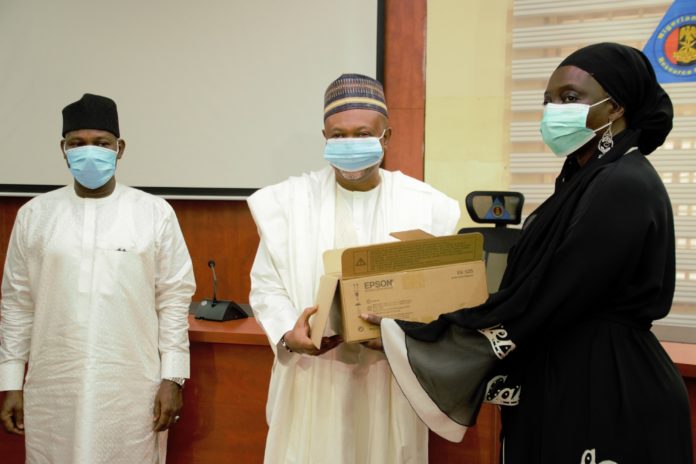DSC_32054 (Middle) The Permanent Secretary of the Ministry of Humanitarian Affairs, Disaster Management and Social Development, Jalal Arabi receiving an ICT equipment from the ECOWAS Commissioner for Social Affairs and Gender, Siga Fatima Jagne; (Left) The Director-General of National Emergency Management Agency (NEMA) AVM Muhammadu Muhammed Rtd. during the presentation of Information and Communication Technology (ICT) equipment on behalf of the ECOWAS Commission to the Ministry