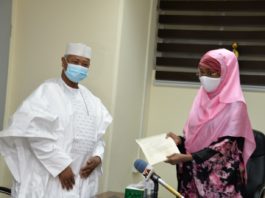(Right) The Honourable Minister of Humanitarian Affairs, Disaster Management and Social Development, Sadiya Umar Farouq receiving letter of Covid-19 palliative from the Executive Secretary Petroleum Equalisation Fund, Ahmed Bobboi.