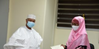 (Right) The Honourable Minister of Humanitarian Affairs, Disaster Management and Social Development, Sadiya Umar Farouq receiving letter of Covid-19 palliative from the Executive Secretary Petroleum Equalisation Fund, Ahmed Bobboi.