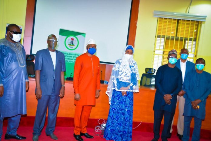 FMHADMSD AND PLWDs (4th left) Honourable Minister of Humanitarian Affairs, Disaster Management and Social Development, Sadiya Umar Farouq, (1st left) Special Adviser on Special Needs to the Minister, Danjuma Atta, (2nd left) Director Humanitarian Affairs, Alhaji Ali Grema, (1st right) David Sabo of Christophel Blinden Mission (2nd right) Country Director, Leprosy Mission in Nigeria, Dr David Sunday Udo