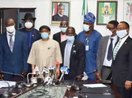 The Honoruable Minister Labour and Employment, Chris Ngige (4th left), Permanent Secretary, Labour and Employment, William Alo (3rd left), President, Nigeria Medical Association (NMA), Prof. Innocent Ujah (5th left), in a group photograph with the Executive members of NMA and the Directors in the Ministry.