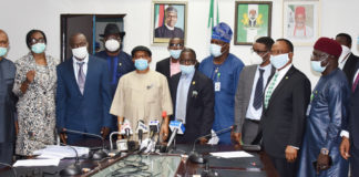 The Honoruable Minister Labour and Employment, Chris Ngige (4th left), Permanent Secretary, Labour and Employment, William Alo (3rd left), President, Nigeria Medical Association (NMA), Prof. Innocent Ujah (5th left), in a group photograph with the Executive members of NMA and the Directors in the Ministry.
