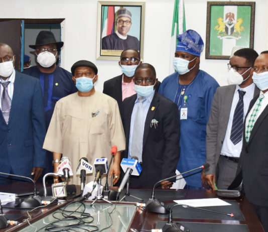 The Honoruable Minister Labour and Employment, Chris Ngige (4th left), Permanent Secretary, Labour and Employment, William Alo (3rd left), President, Nigeria Medical Association (NMA), Prof. Innocent Ujah (5th left), in a group photograph with the Executive members of NMA and the Directors in the Ministry.