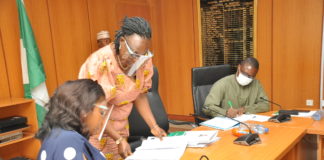 Outgoing Permanent Secretary,Power, Mrs. Didi Walson-Jack mni, Director, Planning, Research and Statistics, Ammonia Standfast and the in-coming Permanent Secretary, Power,Chinyeaka Christian Ohaa during the signing of the Hand Over Notes