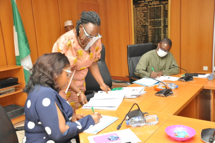 Outgoing Permanent Secretary,Power, Mrs. Didi Walson-Jack mni, Director, Planning, Research and Statistics, Ammonia Standfast and the in-coming Permanent Secretary, Power,Chinyeaka Christian Ohaa during the signing of the Hand Over Notes Outgoing Permanent Secretary,Power, Mrs. Didi Walson-Jack mni, Director, Planning, Research and Statistics, Ammonia Standfast and the in-coming Permanent Secretary, Power,Chinyeaka Christian Ohaa during the signing of the Hand Over Notes