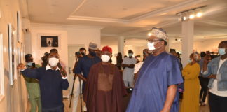 Hon. Minister, Mines and Steel Development, Arc. Olamilekan Adegbite (r) and Hon. Minister of State, Mines and Steel Development, Dr. Uchechukwu Sampson Ogar (m), and other dignitaries at photo exhibition