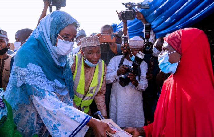 DSC06121 The Hnonourable Minister of Humanitarian Affairs, Disaster Management and Social Development Sadiya Umar Farouq presenting Rural Women in Sokoko state with N20,000 cash one-off Grant