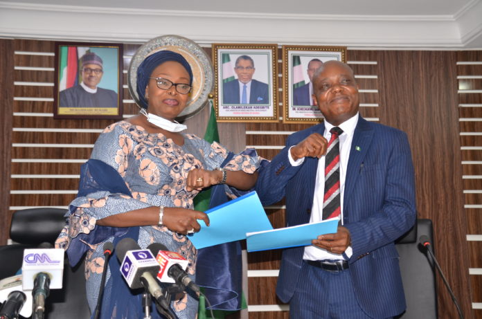 In-coming Permanent Secretary, Dr. Oluwatoyin Akinlade (l), receiving handing-over notes from Out-going Permanent Secretary, Mr. Edet Akpan In-coming Permanent Secretary, Dr. Oluwatoyin Akinlade (l), receiving handing-over notes from Out-going Permanent Secretary, Mr. Edet Akpan