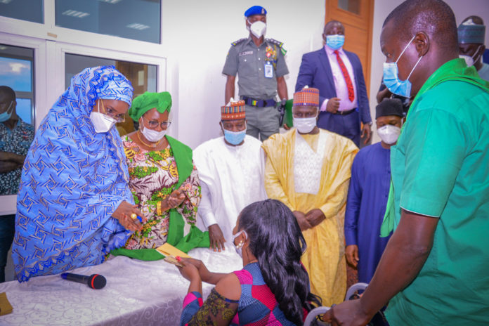 FMHADMSD (L-R) The Honourable Minister of Humanitarian Affairs, Disaster Management and Social Development, Sadiya Umar Farouq, The Honourable Minister of Women Affairs, Dame Paulline Tallen, The Executive Governor of Pleatue State, His Excellence Simon Bako Lalong, The Chairman House Committee on Poverty Alliviation, Muhammed Salome, The Director General of NEMA, AVM, Muhammadu Mohammed. rtd, during the flag off for disbursement of the Conditional Cash Transfer to the vulnerable to mark The International Day for Rural Women at the Pleatue State Government House on, October, 15th 2020.
