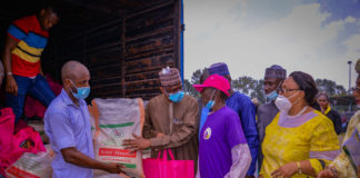 (2ndL) The Permanent Secretary, Federal Ministry of Humanitarian Affairs, Disaster Management and Social Development, Bashir Nura Alkali, (1stR) Director of Social Development Dr. Dorothy Nwodo, during the presentation of palliatives to one of the Older Persons at the grand finale of the 2020 International Day for Older Persons, at the Old Army Parade Ground Garki, Abuja. 20th October, 2020. Photo by Khalid Ahmed