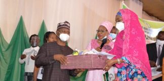 (R) The Honourable Minister of Humanitarian Affairs, Disaster Management and Social Development, Sadiya Umar Farouq, handing over sport items for PWDs to (L) the Executive Secretary, National Commission for Persons with Disabilities, James Lalu, (middle) Director Special Needs, Ministry of Humanitarian Affairs, Disaster Management and Social Development, Onwukwe Nkechi Florence, during the grand finale of the International Day of Persons with Disabilities, in Abuja, on 3rd December, 2020. Photo: Khalid Ahmed.