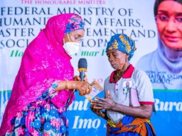 Left; The Honourable Minister of Humanitarian Affairs, Disaster Management and Social Development, Sadiya Umar Farouq, presenting the Cash of N20,000 to one of the beneficiaries, Mrs Mary Ajanogwu from Idiako South Local Government Area of Imo State, during the Flag off of the Federal Government Special Grant for Rural Women at Ajokwu Convention Centre, in Owerri, Imo State, December 3, 2020.