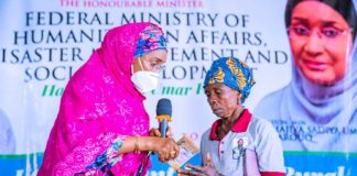 Left; The Honourable Minister of Humanitarian Affairs, Disaster Management and Social Development, Sadiya Umar Farouq, presenting the Cash of N20,000 to one of the beneficiaries, Mrs Mary Ajanogwu from Idiako South Local Government Area of Imo State, during the Flag off of the Federal Government Special Grant for Rural Women at Ajokwu Convention Centre, in Owerri, Imo State, December 3, 2020.
