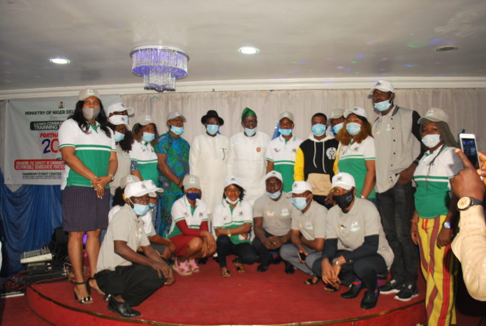 The Honourable Minister of State, MNDA, Sen. Omotayo Alasoadura, flanked by Stakeholders at the event.