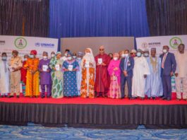 (8th L) The Honourable Minister of Humanitarian Affairs, Disaster Management and Social Development, Sadiya Umar Farouq, (7th L) Country Rep. UNHCR, Mme Chansa Kapaya,(5th l) , Representative of Hon. Federal Commissioner for Refugees, Migrants and Internally Displaced Persons, Ejibunu Tai Hassan, (7th R) The Governor of Borno State, His Excellency, Babagana Umara Zulum, (6th R) Representative of the Honourable Minister of Agriculture, Hajiya Karima Babangida, and others
