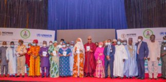 (8th L) The Honourable Minister of Humanitarian Affairs, Disaster Management and Social Development, Sadiya Umar Farouq, (7th L) Country Rep. UNHCR, Mme Chansa Kapaya,(5th l) , Representative of Hon. Federal Commissioner for Refugees, Migrants and Internally Displaced Persons, Ejibunu Tai Hassan, (7th R) The Governor of Borno State, His Excellency, Babagana Umara Zulum, (6th R) Representative of the Honourable Minister of Agriculture, Hajiya Karima Babangida, and others