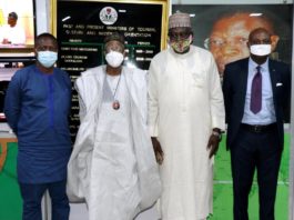 HMIC, Alh. Lai Mohammed receiving PAWA Exec Secretary