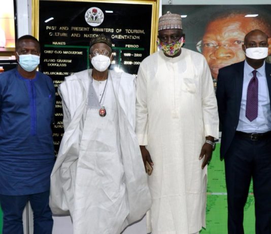 HMIC, Alh. Lai Mohammed receiving PAWA Exec Secretary