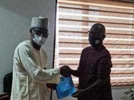 Engr. Festus Yusufu Daudu of the Federal Ministry of Communications and Digital Economy and Permanent Secretary, Political and Economic Affairs, Mr. Andrew David Adejo at the conference room of the Political and Economy Affairs Office of OSGF, Shagari House.