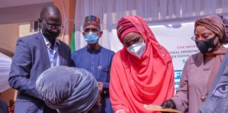 2nd Right) The Honourable Minister of Humanitarian Affairs, Disaster Management and Social Development, Sadiya Umar Farouq,(1st Right) Minister of State for FCT,  Dr. Ramatu Tijjani Aliyu (2nd Left) the Permanent Secretary of the Ministry, Bashir Nura Alkali, (1st Left) Director Humanitarian Department, Grema Ali Alhaji, and a Beneficiary, Ruth Kadiri during the Flag - Off of the Federal Government Cash Grant For Rural Women in FCT, on 21st January, 2021. Abuja. Photo: Khalid Ahmed.
