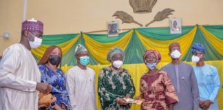 (2nd Right) Representative of the Honourable Minister of Humanitarian Affairs, Disaster Management and Social Development, The Permanent Secretary of the Ministry, Bashir Nura Alkali, (4th Left) The Deputy Governor of Ogun State, Her Excellency Noimat Salako-Oyedele, (2nd Left) Special Adviser to Governor on Women Affairs, Honourable Adijat Adeleye, (1st Left) Director Humanitarian Affairs, Grema Ali Alhaji, (3rd Left) Honourable Commissioner Special Duties and Intergovernmental Affairs, Barrister Femi Ogunbanwo, (1st Right) Permanent Secretary Special Duties and Intergovernmental Affairs, Mr Orasanya Kehinde, (3rd Right) a Beneficiary Saidat Akande, during the Federal Government Special Grant for Rural women in Ogun State, held at the Government Office, Ogun State, on the 30th January, 2021. Photo: Khalid Ahmed.